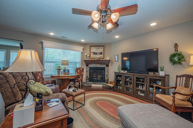 1331 Lantern Pointe Dr, Moberly, MO 65270 - living room featuring ceiling fan, plenty of natural light, recessed lighting, a stone fireplace, and wood finished floors