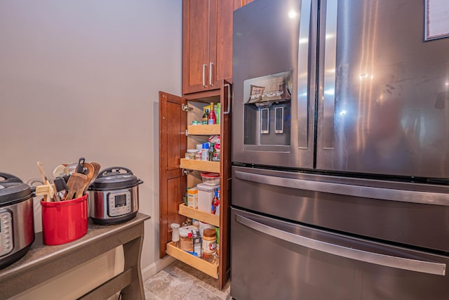 1331 Lantern Pointe Dr, Moberly, MO 65270 - kitchen view of stainless steel refrigerator with ice dispenser and brown cabinets