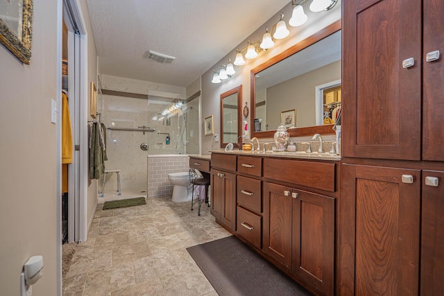 1331 Lantern Pointe Dr, Moberly, MO 65270 - bathroom with double vanity, a shower stall, and a textured ceiling