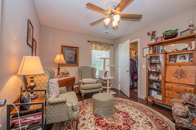 1331 Lantern Pointe Dr, Moberly, MO 65270 - living area with ceiling fan, wood finished floors, and a textured ceiling