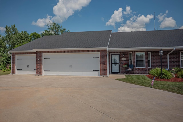 1331 Lantern Pointe Dr, Moberly, MO 65270 - view of front of home with brick siding, concrete driveway, and a garage