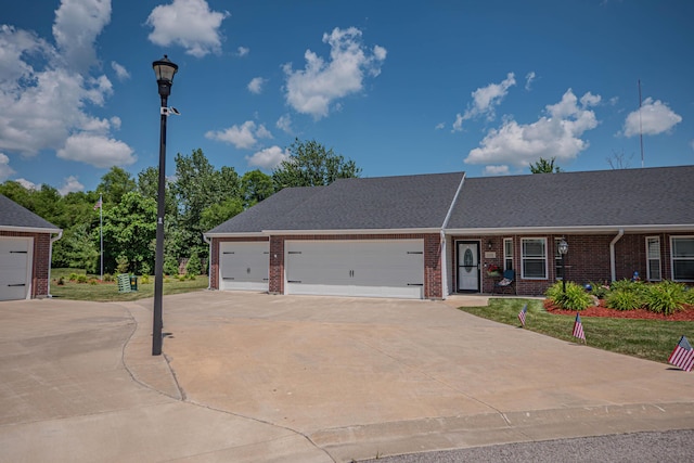 1331 Lantern Pointe Dr, Moberly, MO 65270 - view of front of home with brick siding, concrete driveway, and an attached garage