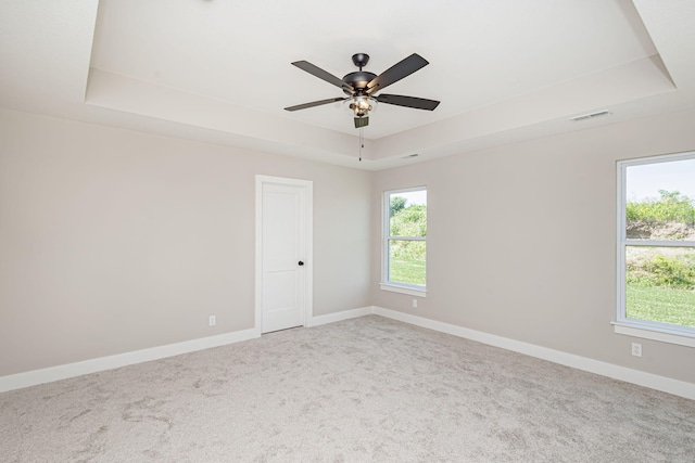 4512 Chambers Bay Dr, Columbia, MO 65201 - carpeted spare room with a raised ceiling and ceiling fan