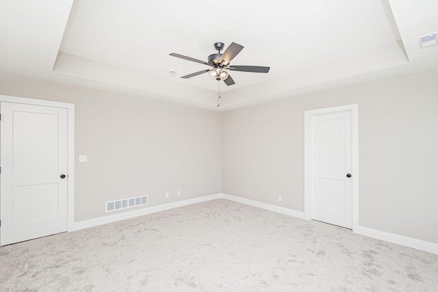 4512 Chambers Bay Dr, Columbia, MO 65201 - carpeted empty room with a raised ceiling and a ceiling fan