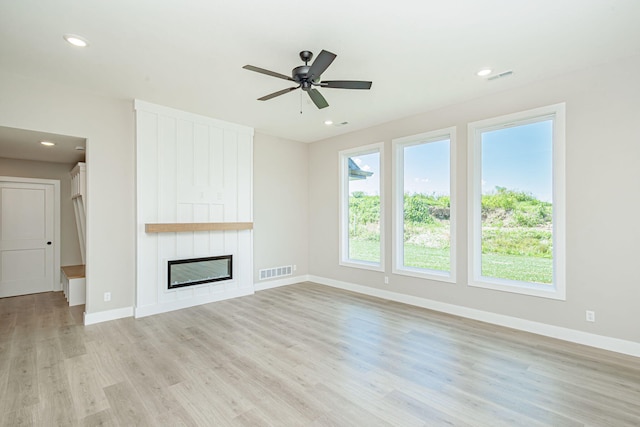 4512 Chambers Bay Dr, Columbia, MO 65201 - unfurnished living room featuring light wood-type flooring, a fireplace, recessed lighting, and a ceiling fan