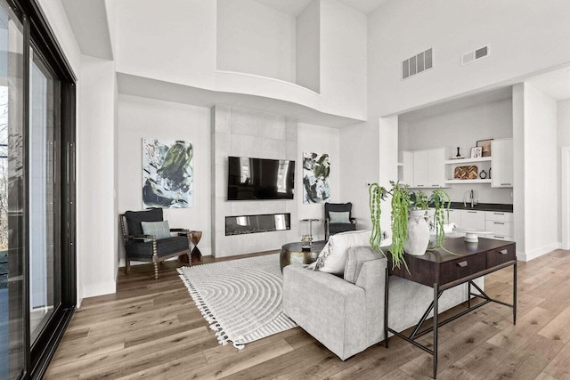 4512 Chambers Bay Dr, Columbia, MO 65201 - living area with a towering ceiling and light wood-style floors