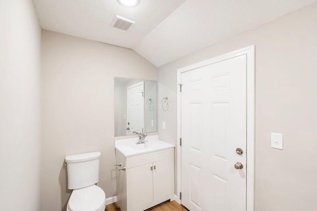 1101 Pannell St, Columbia, MO 65201 - bathroom with vanity, vaulted ceiling, and wood finished floors