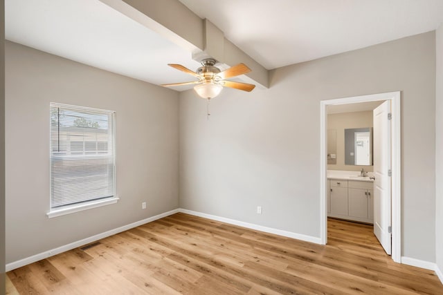 1101 Pannell St, Columbia, MO 65201 - unfurnished bedroom with light wood finished floors, ensuite bath, and a ceiling fan