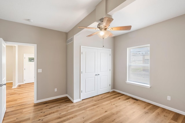 1101 Pannell St, Columbia, MO 65201 - unfurnished bedroom featuring light wood-style flooring, a closet, and a ceiling fan