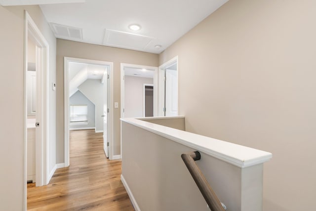 1101 Pannell St, Columbia, MO 65201 - corridor featuring light wood-style floors, an upstairs landing, and attic access