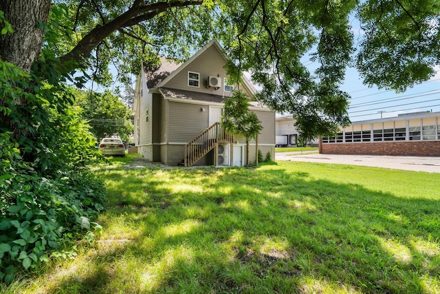 1101 Pannell St, Columbia, MO 65201 - view of home's exterior with a lawn and stairway