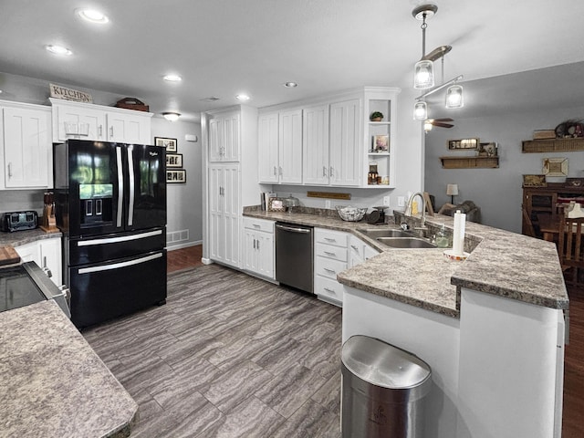 307 Jameson Dr, Ashland, MO 65010 - kitchen with black refrigerator with ice dispenser, stainless steel dishwasher, a peninsula, white cabinetry, and recessed lighting