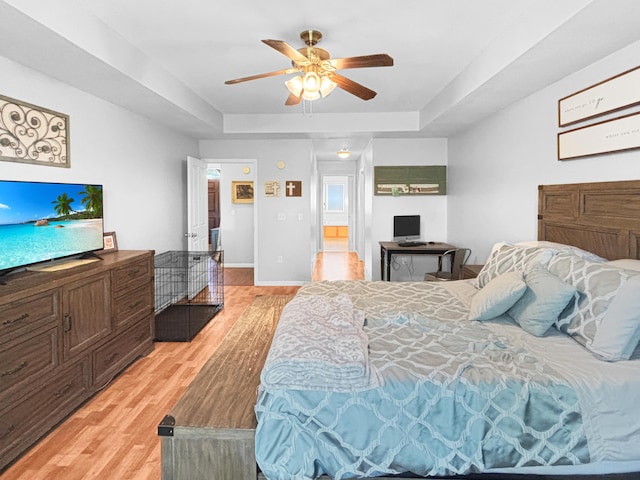 307 Jameson Dr, Ashland, MO 65010 - bedroom featuring a tray ceiling, light wood finished floors, and a ceiling fan