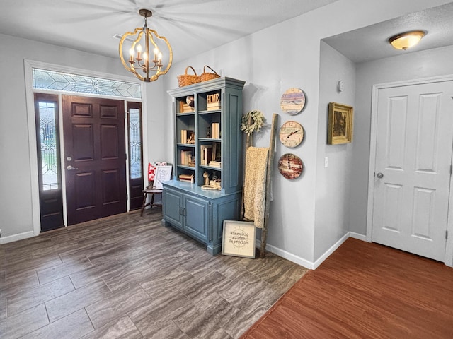 307 Jameson Dr, Ashland, MO 65010 - foyer with a chandelier and dark wood-style floors