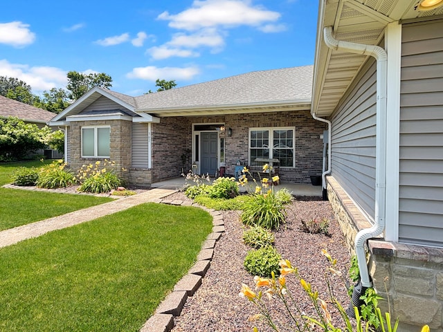 307 Jameson Dr, Ashland, MO 65010 - view of front of property with a front lawn, a shingled roof, brick siding, and stone siding