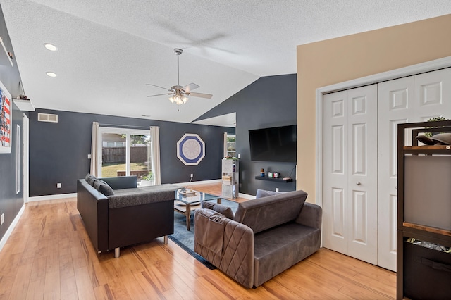 547 E Clearview Dr, Columbia, MO 65202 - living room featuring ceiling fan, vaulted ceiling, light wood-type flooring, and a textured ceiling