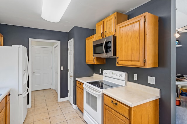 547 E Clearview Dr, Columbia, MO 65202 - kitchen featuring white appliances, light countertops, and light tile patterned floors