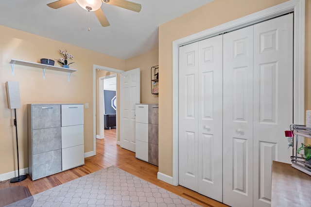 547 E Clearview Dr, Columbia, MO 65202 - bedroom with light wood finished floors, a closet, and ceiling fan