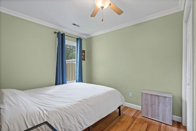 547 E Clearview Dr, Columbia, MO 65202 - bedroom featuring wood finished floors, crown molding, and ceiling fan