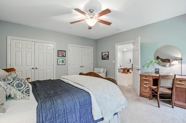 4106 Fritz Ct, Columbia, MO 65203 - bedroom featuring two closets, light carpet, a desk, and ceiling fan