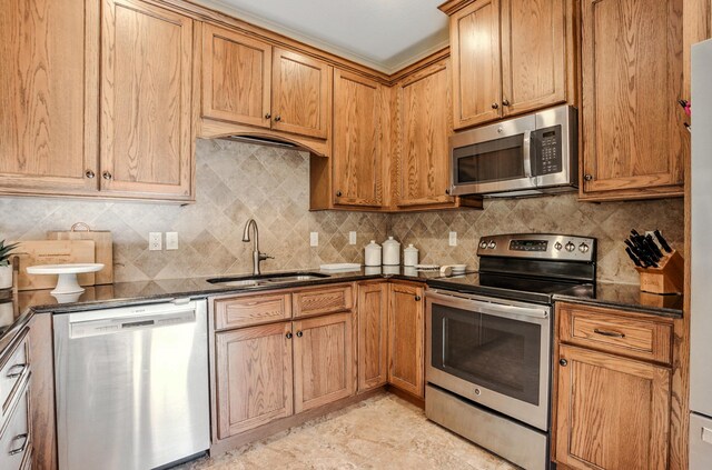 4106 Fritz Ct, Columbia, MO 65203 - kitchen with stainless steel appliances, tasteful backsplash, and dark stone counters