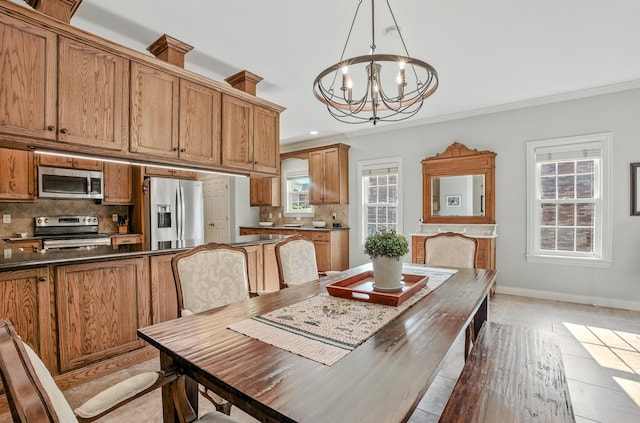 4106 Fritz Ct, Columbia, MO 65203 - dining area with a chandelier, ornamental molding, light tile patterned floors, and recessed lighting