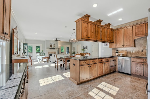 4106 Fritz Ct, Columbia, MO 65203 - kitchen with dishwasher, dark countertops, a peninsula, ornamental molding, and backsplash