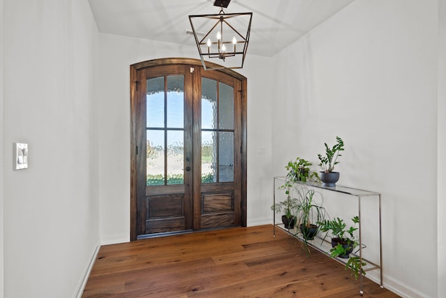 7405 Brackenhill Dr, Columbia, MO 65203 - foyer featuring french doors, a chandelier, and hardwood / wood-style flooring