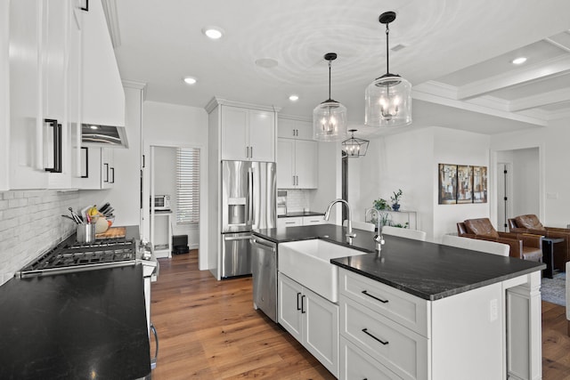 7405 Brackenhill Dr, Columbia, MO 65203 - kitchen with appliances with stainless steel finishes, recessed lighting, light wood-style flooring, decorative backsplash, and white cabinetry