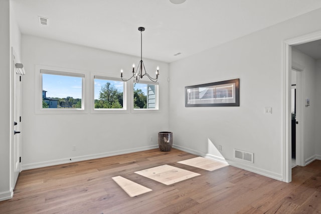 7405 Brackenhill Dr, Columbia, MO 65203 - unfurnished dining area featuring a chandelier and light wood-style floors