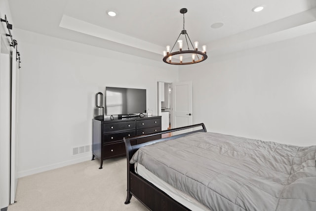 7405 Brackenhill Dr, Columbia, MO 65203 - bedroom featuring a chandelier, a raised ceiling, light colored carpet, a barn door, and recessed lighting