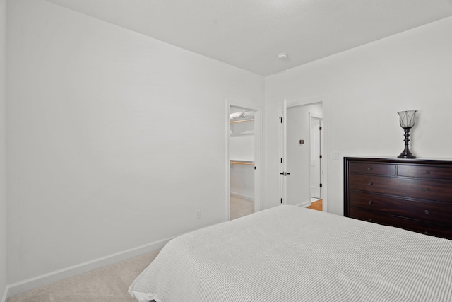 7405 Brackenhill Dr, Columbia, MO 65203 - carpeted bedroom with baseboards and a spacious closet
