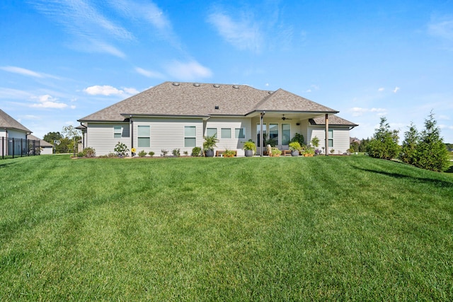 7405 Brackenhill Dr, Columbia, MO 65203 - rear view of property featuring a lawn, ceiling fan, and a shingled roof