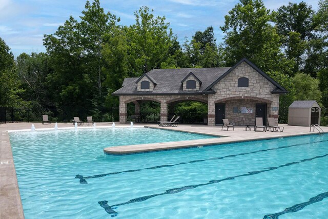 7405 Brackenhill Dr, Columbia, MO 65203 - community pool with a patio area and a shed