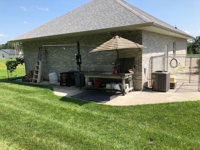 3824 Canyon Ridge Dr, Columbia, MO 65202 - rear view of property with brick siding, a patio area, and roof with shingles