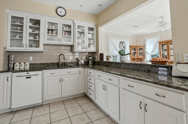 3824 Canyon Ridge Dr, Columbia, MO 65202 - kitchen featuring white dishwasher, a ceiling fan, white cabinetry, decorative backsplash, and ornamental molding