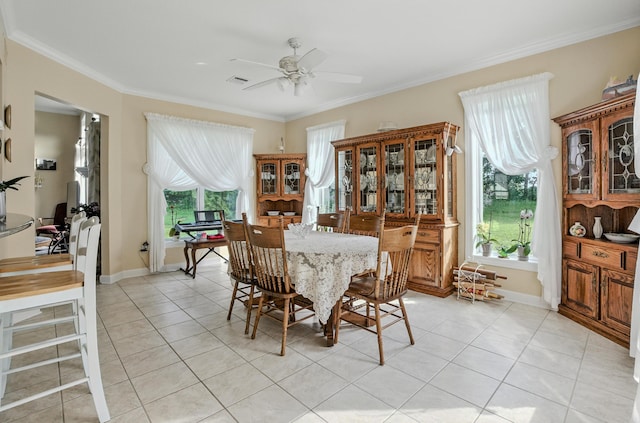 3824 Canyon Ridge Dr, Columbia, MO 65202 - dining space featuring ceiling fan, light tile patterned floors, plenty of natural light, and crown molding