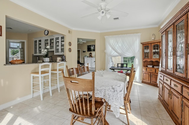 3824 Canyon Ridge Dr, Columbia, MO 65202 - dining area with ceiling fan, light tile patterned floors, and ornamental molding