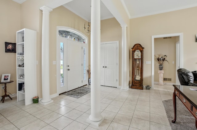 3824 Canyon Ridge Dr, Columbia, MO 65202 - foyer entrance featuring ornate columns, crown molding, and light tile patterned floors