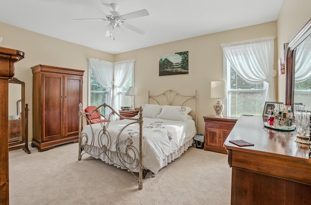 3824 Canyon Ridge Dr, Columbia, MO 65202 - bedroom with light colored carpet and ceiling fan
