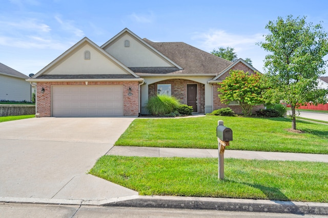 3106 Crabapple Ln, Columbia, MO 65203 - view of front of home featuring a front lawn, an attached garage, concrete driveway, brick siding, and stucco siding