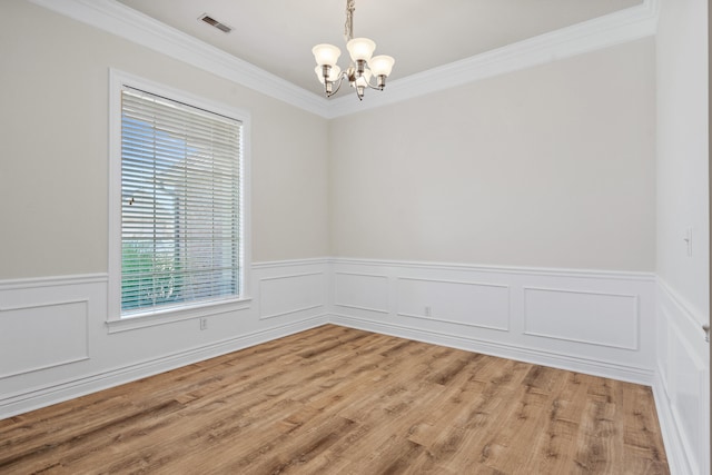3106 Crabapple Ln, Columbia, MO 65203 - spare room with a chandelier, crown molding, wainscoting, and light wood finished floors