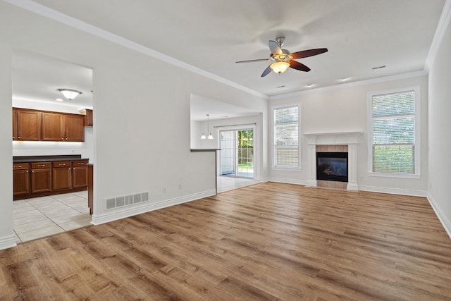 3106 Crabapple Ln, Columbia, MO 65203 - unfurnished living room featuring ceiling fan, light wood-type flooring, ornamental molding, and a fireplace