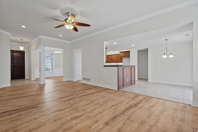 3106 Crabapple Ln, Columbia, MO 65203 - unfurnished living room with a chandelier, light wood-type flooring, a ceiling fan, recessed lighting, and decorative columns