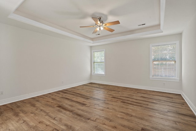 3106 Crabapple Ln, Columbia, MO 65203 - spare room featuring a raised ceiling, ceiling fan, wood finished floors, and ornamental molding