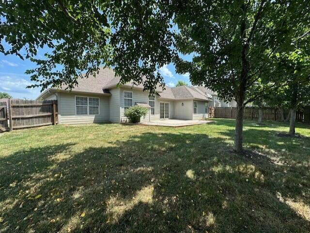 3106 Crabapple Ln, Columbia, MO 65203 - back of property featuring a fenced backyard and a patio