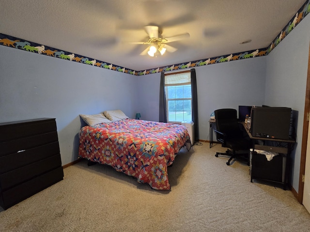 7951 N Marigold Ct, Columbia, MO 65202 - bedroom featuring light carpet, ceiling fan, and a textured ceiling