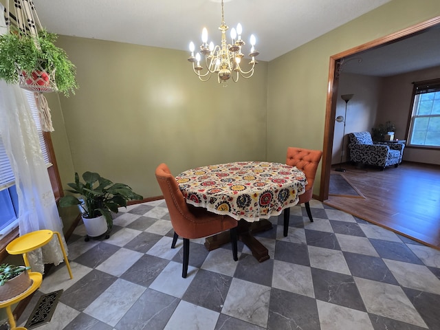 7951 N Marigold Ct, Columbia, MO 65202 - dining space featuring a chandelier and baseboards