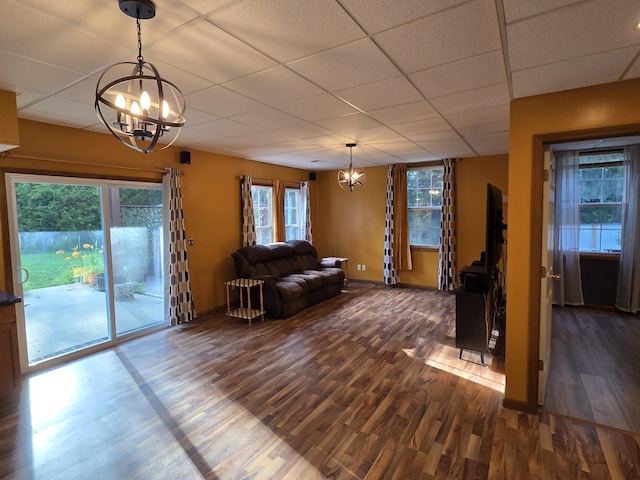 7951 N Marigold Ct, Columbia, MO 65202 - living area featuring a chandelier, dark wood finished floors, and a paneled ceiling