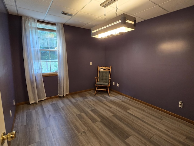 7951 N Marigold Ct, Columbia, MO 65202 - spare room with wood finished floors and a drop ceiling